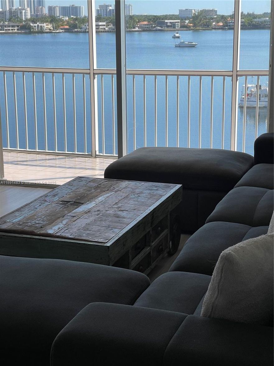 Magnificent top-floor unit, 2/2 with a split floor plan for privacy. Enjoy panoramic and amazing water views throughout the entire home from the large L-shaped balcony. Features linoleum flooring and is fully furnished. The primary bedroom has a huge closet. Next door to Plum Supermarket, retail stores, restaurants, and a bank, all just a minute away. The complex offers 5 pools, a gym, billiards, ping pong, musical events & shows, free Friday night dance, free yoga, zumba, domino, and more. All in a secured gated area with a 2.5-mile scenic nature path. Freebe, car , free bus ride in front of the building. Best location in the heart of Aventura. One tenant must be 55 years or older. Won't last, schedule your showing today using ShowingTime, text listing agent, about a 2-week approval time