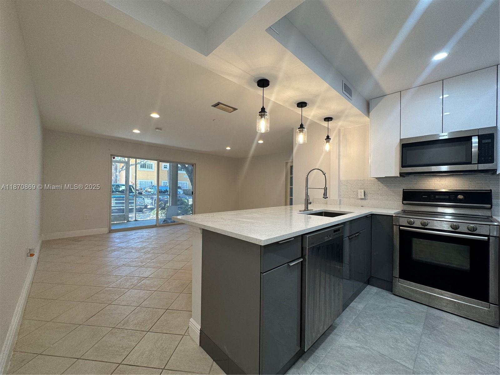 Beautiful corner unit conveniently located on ground floor, nicely remodeled with all new kitchen quarts countertops and lots of natural light. Tile floor throughout, new appliances and all LED lights. Washer and dryer inside the unit, 2 assigned parking spaces close to the unit. Very nice boutique and peaceful community with pool, party room, carwash station and conveniently located close to several supermarkets, fine dining, the new Dania Casino, the amazing Dania Point Mall, FLL airport, seaport and only a 1.5 mile to the gorgeous Dania Beach. ALL AGES and pet allowed.