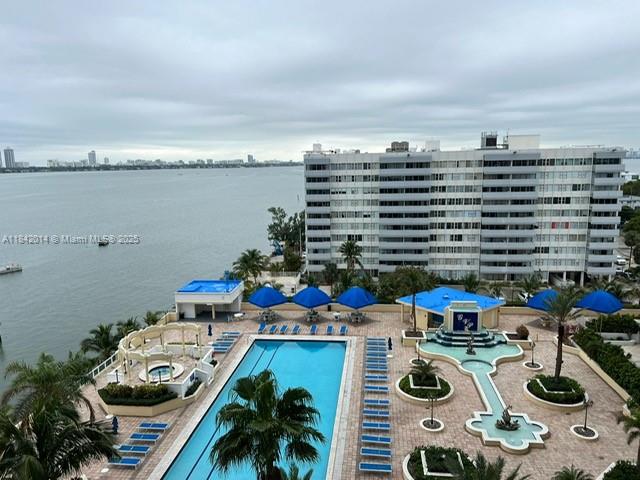 Two bedroom two bath unit located on the 11th floor of The Grand View Palace. Enjoy bay views & pool views from the large balcony. The kitchen features granite counter tops and stainless steel appliances, laminated wood floors throughout the unit. Master bedroom has walk in closet and en-suite bathroom. Washer and dryer in unit. Water is included. Management on-site. Pets not allowed. 2 PARKING SPACES INCLUDED, G2-510 & G2-422. Association requires $500 security deposit. Move in with first month and one month security deposit.