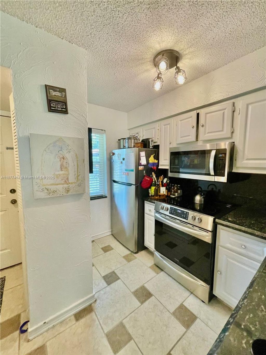 Photo of 2106 S Cypress Bend Dr #107, Pompano Beach, FL 33069 (MLS # A11877462)