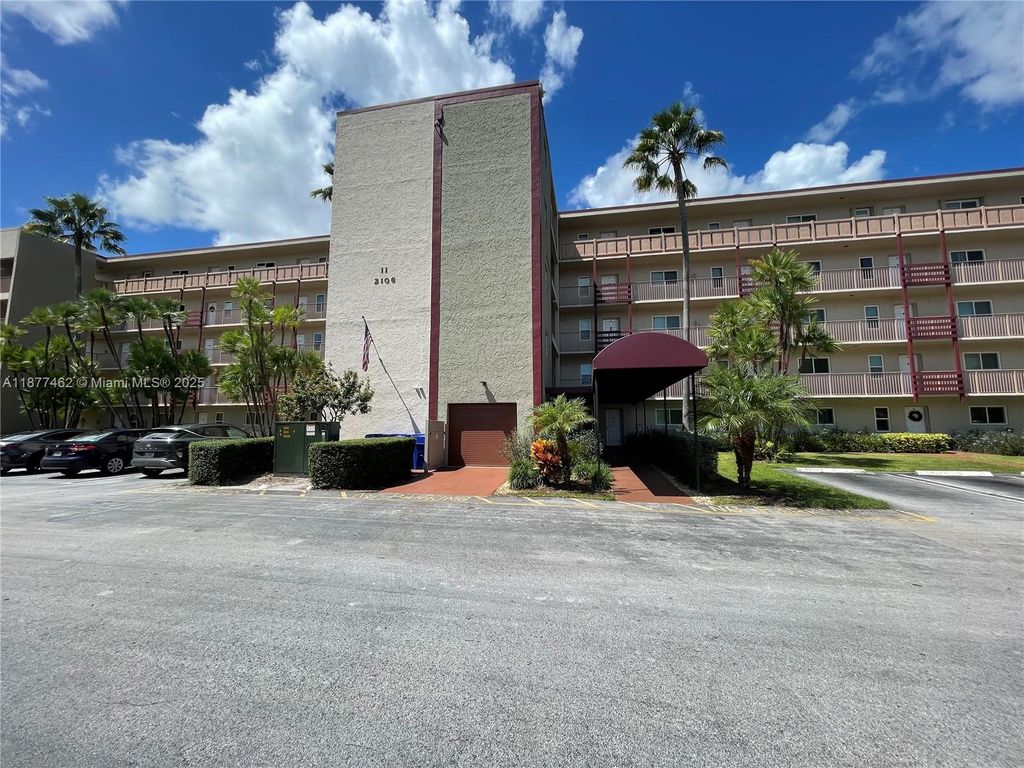 Photo of 2106 S Cypress Bend Dr #107, Pompano Beach, FL 33069 (MLS # A11877462)