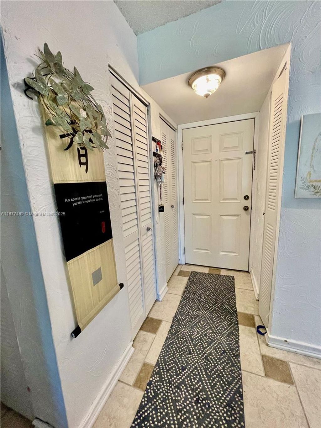 Photo of 2106 S Cypress Bend Dr #107, Pompano Beach, FL 33069 (MLS # A11877462)