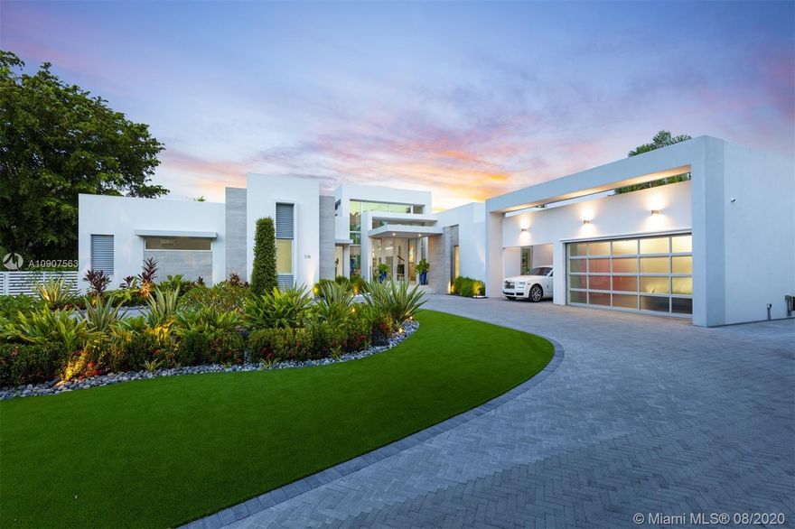 Gorgeous 1-story modern estate inspired by European architecture & located in sought after N. Pinecrest at the end of a quiet cul-de-sac street. This spectacular estate is nested on an acre lot & surrounded by immaculate custom landscaping. Impressive entry w/high ceilings allowing for abundance of natural light to radiate throughout every angle, expansive formal living room & dining overviewing resort style pool, jacuzzi & deep backyd. Designer Kitchen w/Quartz countertops, gas slide in range, Subzero refrigerators & Wolf appl. Lavish master suite offers walk-in closet, pool access, Zen master bath w/floating tub, Teak shower flr & separate steam shower. Extra Feat: Detached home office w/ Cabana bath, storage rm, summer kitchen, 26 solar panels, imp win/drs & 2 car gar + carport.