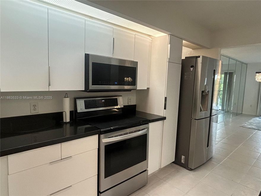 Welcome to resort-style living in the highly sought-after Century Village. This spacious and bright 2-bedroom, 2-bathroom condo features a fully remodeled kitchen with modern finishes, as well as updated bathrooms. Enjoy easy maintenance with tile flooring throughout and the convenience of an in-unit washer and dryer. Located in a secure, gated community, you’ll be just minutes from Pembroke Lakes Mall, Publix and a wide variety of restaurants. Century Village offers an unmatched lifestyle with resort-style amenities such as a golf course, on-site theater, fitness center, pools, tennis, and more. Whether you're looking for year-round living or a seasonal retreat, this move-in-ready condo has it all. Don’t miss your chance to enjoy the best of South Florida living! Must be 55+ yrs of age.