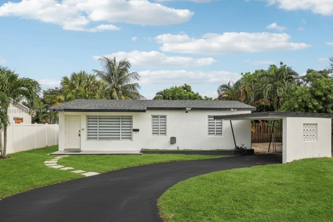 Welcome to this beautifully remodeled 3-bedroom, 2-bath home blending contemporary style with everyday comfort. The open-concept floor plan showcases a chef-inspired kitchen with a large island, quartz countertops, sleek white cabinetry, and stainless steel appliances. Bathrooms feature modern elegance with floor-to-ceiling tile and updated fixtures, while white porcelain floors enhance the home’s bright, seamless flow. Outdoors, enjoy an expansive lot with a backyard retreat designed for entertaining and relaxation. A sparkling pool invites year-round enjoyment of South Florida’s warm weather. Featuring a new roof and PVC plumbing updated in 2024, this property is perfect as a residence or investment, ideal for short-term rental or Airbnb.