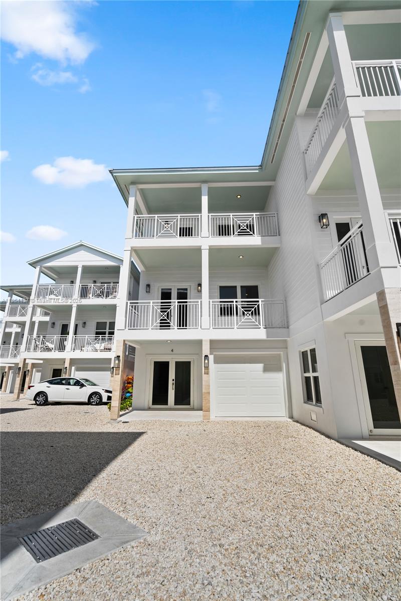 Peaceful Palms, a newly developed gated community offering 15 exclusive high-end townhomes in the heart of the Florida Keys. This oceanfront retreat boasts breathtaking views of the renowned Sandbar and Alligator Reef Lighthouse, providing the perfect blend of luxury, relaxation, and investment potential. Each three-bedroom, three-bathroom townhome is thoughtfully designed with expansive balconies on both the second and third floors, a spacious garage, and pet-friendly accommodations. Peaceful Palms is designed to accommodate weekly rentals with the proper permitting, offering an incredible opportunity for investors. With the possibility of new building permits becoming unavailable in the Florida Keys, now is the time to secure your place in this sought-after destination.