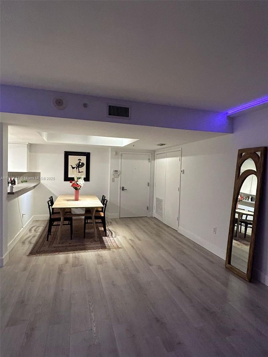 Beautifully renovated two bedroom two bath with a spectacular ocean view on a high floor priced to sell ! Kitchen has great appliances and cabinetry, which is less than a year old, with counter opening out dining room  with custom drop ceiling. Living room features LED track lighting, professionally set. Apartment has newly installed motorized window blinds. Impact doors and windows and balcony has some of the greatest views of Miami Beach from Ocean to the city itself. Master bedroom features huge closet with impact lockable steel door, ideal for valuables, Master bathroom, beautifully tiled with spacious bathtub and shower. Unit comes with extra parking space so two parking spaces total very rare for this building!
