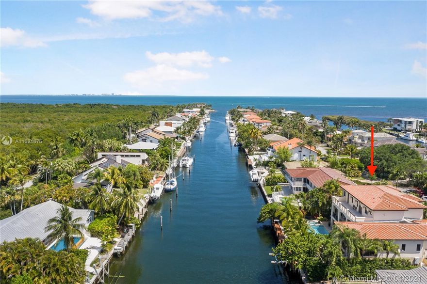 Welcome to Boater's Paradise! This elegant waterfront home in the exclusive "Gables by the Sea" gated community will bring you peace, serenity and wonderful outdoor living space that will feel like a vacation every day.  Enjoy a relaxing boating lifestyle with a 75-foot private dock and a boat lift NO bridges just a few minutes sailing to Biscayne Bay. This is an ultimate endless entertainment home with a Pool/Spa, BBQ area and Game/TV rooms surround by a well-manicured landscape yard. The home features the highest quality of marble finishes and hardwood floors, hurricane impact windows and doors and a complete video surveillance system. Spacious floor plans with 5 beds + 6.5 baths and a plenty of storage. Close proximity to best public and private schools, parks, restaurants and malls.