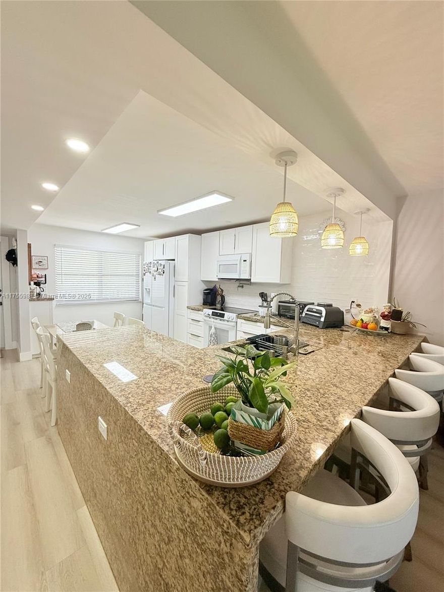 All new... FULLY RENOVATED, 2BR/2BA. NEW IMPACT GLASS WINDOWS, NO POPCORN CEILING. NO POLY PIPES  NEW ELECTRIC TANKLESS, NEW DOORS,  new baseboards, and hardware. The designer open kitchen features extensive cabinets, NEW APPLIANCES, granite countertops, and a full tile backsplash. New elevator 2024, and new Roof 2025 waterproof VINYL throughout. ,  new AC condenser. Large laundry room w/ lots of storage & full-size washer/dryer.  —guest bathroom with shower and porcelain tile.. Enjoy a tranquil golf view. Amenities include 24/7 security, heated pool, movies, restaurants, shuttle service, fitness center, golf, tennis. MOST SPECIAL!   Experience luxurious living at its finest!. motivated Seller ..