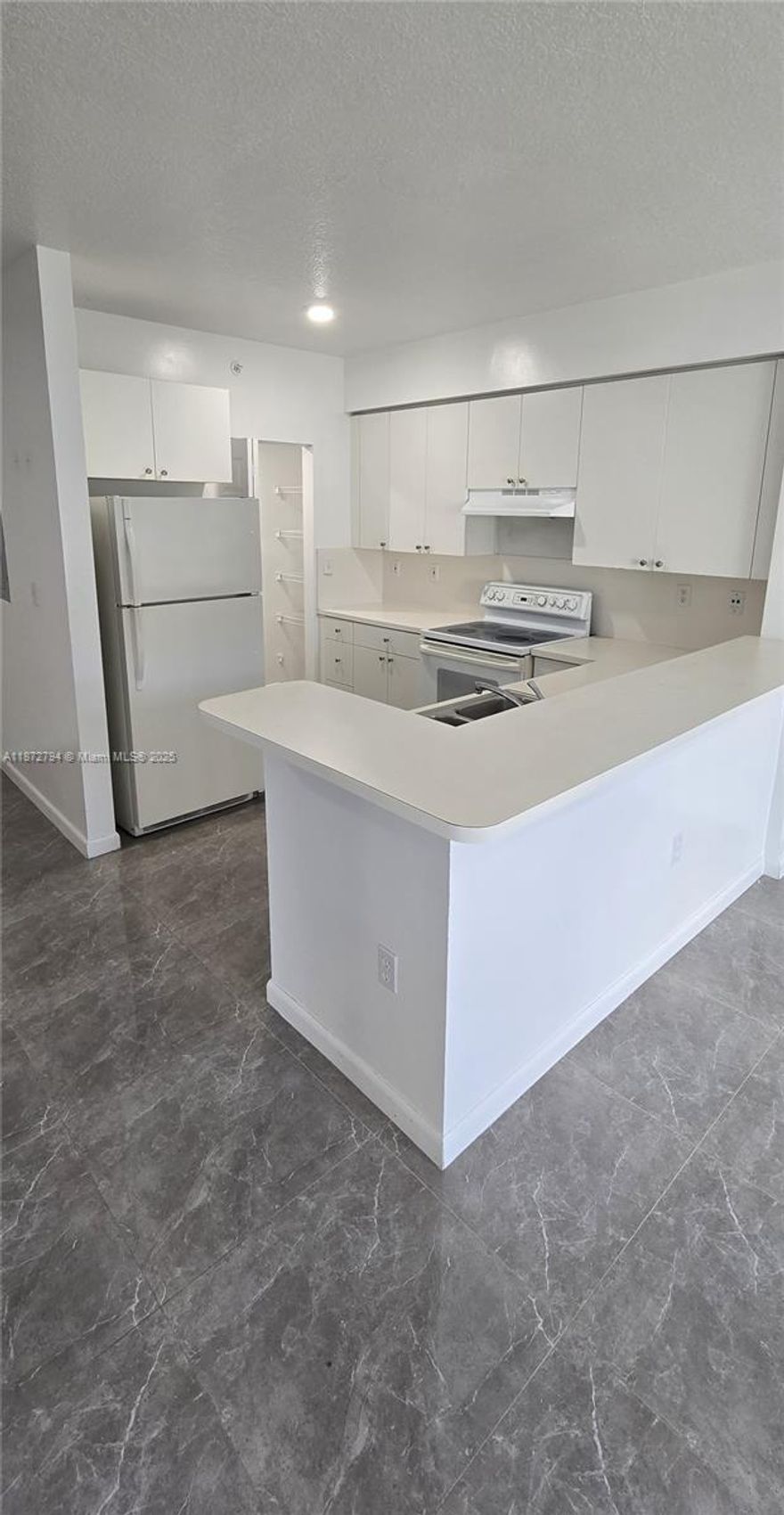 Spacious and Convenient 1-Bedroom, 1-Bathroom Apartment! Located on the 4th floor near the elevator, this unit features two balconies, brand-new tile flooring, and washer/dryer connection available for installation. Very spacious layout with central A/C. Includes 1 assigned parking space with the possibility of additional parking permits in designated areas. Convenient location with easy access to main roads. Located in a Gated Community Utilities not included.