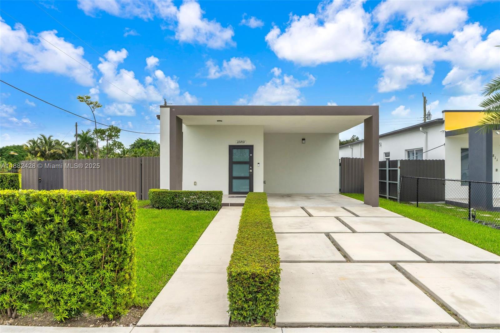 This stunning, nearly new property features modern details and luxury finishes in an excellent central location. It offers impact windows, elegant flooring, and a functional design that combines comfort and style.
An additional outdoor kitchen and bathroom under roof, together with the spacious lanai, provide the perfect setting to enjoy the outdoors at any time of day. The property is fully fenced with durable metal fencing and sits on a corner lot, offering extra privacy and security.
A move-in ready residence, ideal for those seeking location, quality, and style all in one.