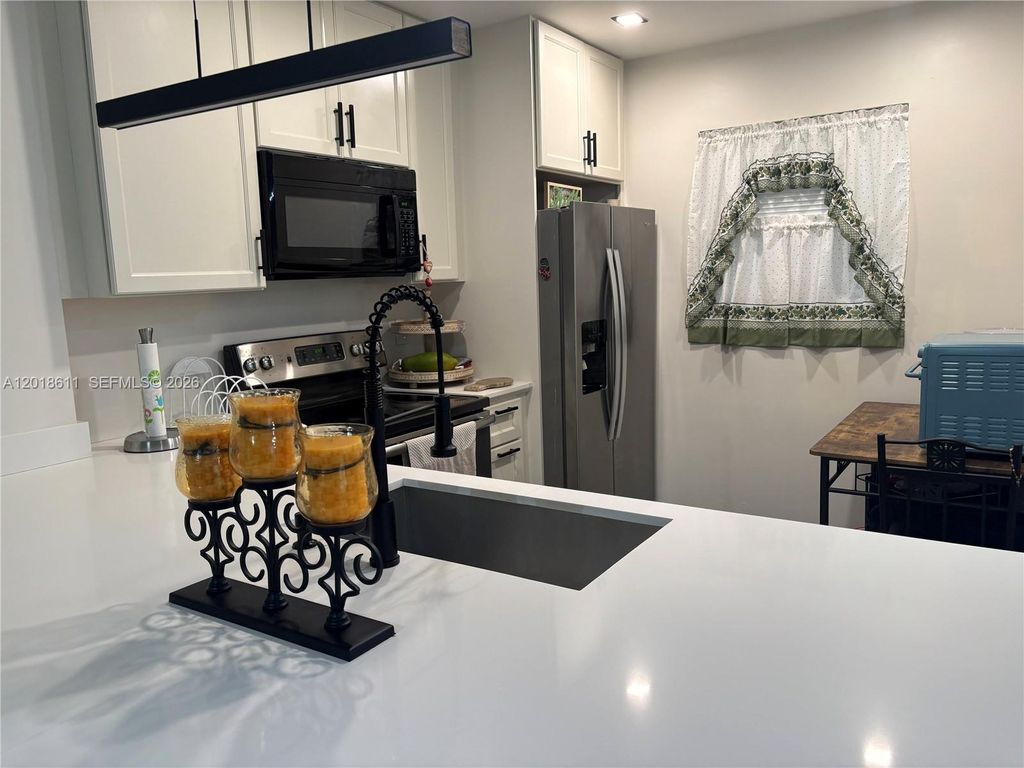 Photo of 300 Berkley Rd #212, Hollywood, FL 33024 (MLS # A12018611)