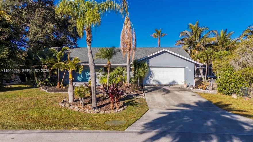 This beautiful and spacious 5-bedroom, 2-bath home, including a new roof (2020), complete exterior paint job (2020), water heater (2020), A/C (2017), and partial impact windows installed in 2024 for added protection and efficiency. A brand-new tiki roof (2025) enhances the outdoor living space, perfect for enjoying South Florida’s year-round sunshine.
Inside, the home features a flexible layout with a unique enclosed den designed as a bar/lounge area, complete with counter seating overlooking the quiet backyard waterfront — an ideal setting for entertaining or relaxing while taking in peaceful water views. Step outside to a beautifully crafted wood deck that creates a private backyard retreat, perfect for gatherings, outdoor dining, or unwinding by the water. A large 2-car garage provides ample storage and parking.
An adjacent lot is also available for purchase (sold separately at $170K), and the seller would prefer to sell both together — offering a rare opportunity to expand the yard, enhance privacy, or create a multi-lot property.
Conveniently located near major roadways, shopping, dining, and everyday conveniences, this home combines valuable upgrades, distinctive character, and desirable canal-side living.