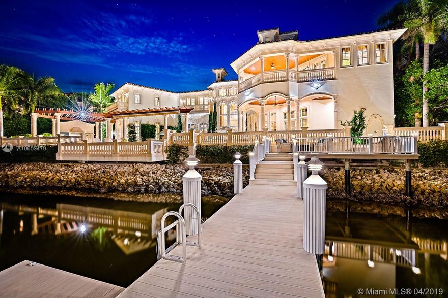 This Grand Waterfront Estate is timeless elegance personified. The moment you walk in the front door beauty & opulence greet you. The finest of craftsmanship & detailing are at every turn in every room... intricate ceiling & floor moldings, Venetian plaster walls, custom stone & wood floors, Tiffany styled glass ceiling in a true wine room, home theater & much, much more. A new roof, the pool & patio were totally redone, marble exterior walls & moldings added, solid brass hardware throughout, a new butlers pantry, new AC units, & the 2-bedroom guest suite redesigned are a few of the items that were renovated in 2017. The lavish master suite is the perfect place to relax & pamper yourself. Enjoy countless hours on the private balcony... (See Supplemental)