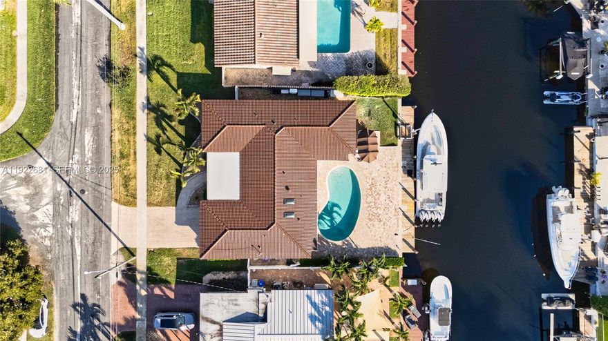 Prime Pompano Beach fully furnished waterfront home. Move-in ready. Features a heated saltwater pool, smart pool pump and 1,500-lb jet ski lift. Protected with impact windows, doors, skylights and a barrel-tile roof with silicone coating. Enjoy natural gas cooking, tankless water heater, new A/C vents, smart-home system, smart sprinkler and PVC plumbing with sleeved line. Split layout with tile, laminate bedrooms, custom closets and Garage Trac flooring. Outdoor living includes a summer kitchen, gas grill, speakers, TV, wood ceilings and a 70’ dock with 2022 seawall footer.