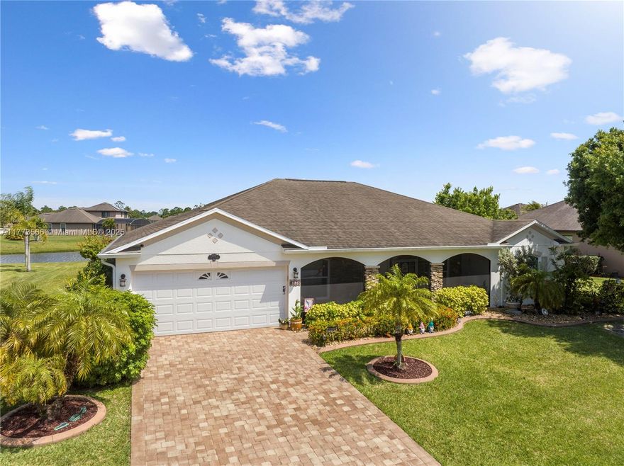 Florida living at its best! 4/2 Lake Front home features upgrades galore! Drive up to the paved driveway, enter the welcoming screened porch, walk in to the formal living and dining room w/high ceilings. Features 2 car garage, laundry room, split floor plan, huge master room w/two walk in closets. Eat-in kitchen w/island & prep sink, double pantry, open to family room making entertaining comfortable and enjoyable. Walk out to the enormous 25x40 screened Lanai & enjoy your coffee while taking in stunning sunrises over the lake, stay enjoy the days and evenings in serenity. Updates include, impact windows, back door and garage door, accordion shutters, extra insulation, plantation shutters, recess lighting, 7 ceiling fans, water heater 2024, AC 2021 w/10 yr warranty, and sprinkler pump 2024.