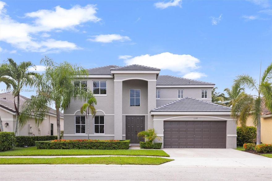 Welcome to this stunning 5-bedroom, 4-bathroom home in Savanna, Weston’s premier community. Offering 2,798 SF of living space, this residence boasts a brand-new roof (2025), fresh paint (2025), and a beautifully remodeled kitchen with quartz countertops, wood cabinets, and stainless steel appliances. Enjoy the convenience of a 1st-floor bedroom. The luxurious primary bath features dual sinks, a Roman tub, and a separate shower. Outside, lush landscaping complements the property.  Enjoy the wide lake views from the backyard, perfect for relaxation and entertaining family and friends. Take advantage of the amazing amenities which include a clubhouse, pool, lap pool, basketball court, street hockey court, pickleball court, and much more. Don't miss this exceptional opportunity!
