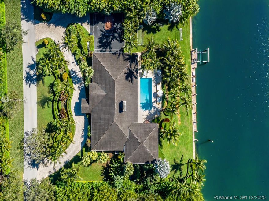 Extraordinary 200ft WATERFRONT Property with 80ft dock in the exclusive GABLES ESTATES Gated Community. With a lush 41,000 LOT this is the ideal family home for someone looking to own in one of the most coveted gated communities in CORAL GABLES. With a single story feel inside of its 7,341SF you will find 6 beds,6.5 baths including a beautiful master suite with its own private terrace, an expansive gym, home theatre, full bar, large chefs kitchen with water views, half court & 4 car garage ideal for a car aficionado including 70 KW full house Generator. Enjoy the amazing view of your 200ft of water with offering direct access to the ocean from the large outdoor area, complete with covered terraces and pool, truly a boaters dream. This property is the perfect opportunity to make it your own