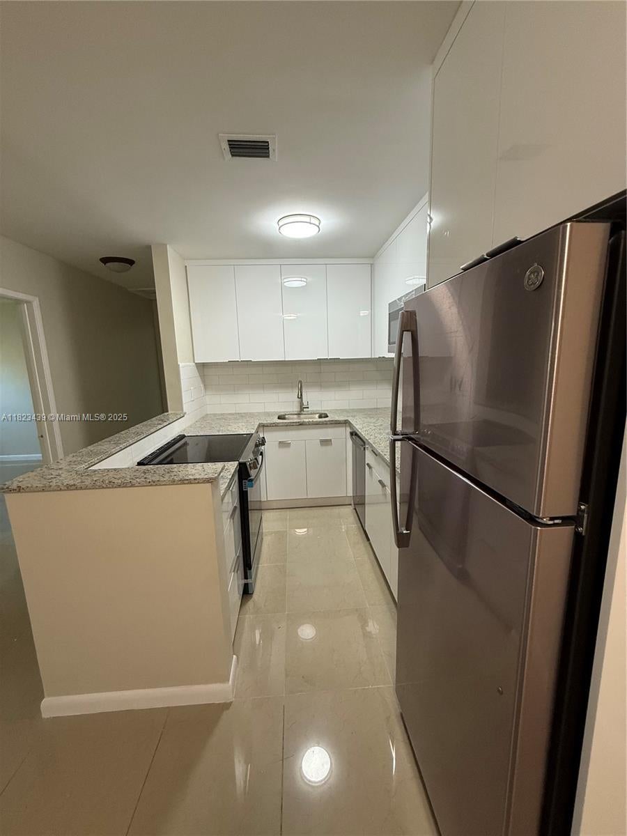 Photo of 1017 SE 22nd Ave #207, Pompano Beach, FL 33062 (MLS # A11823439)