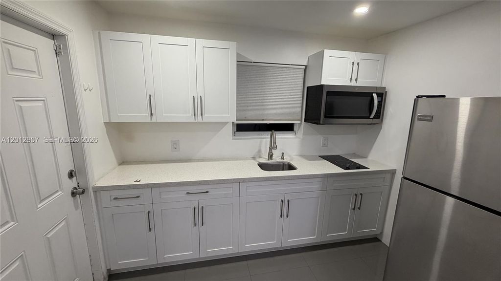 Photo of 1212 E River Dr #2, Margate, FL 33063 (MLS # A12012907)