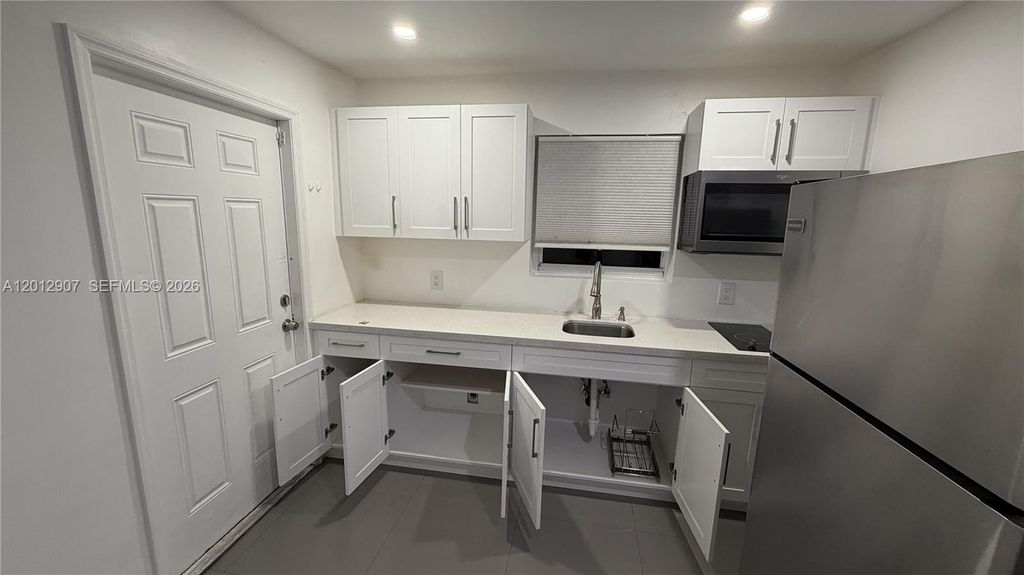 Photo of 1212 E River Dr #2, Margate, FL 33063 (MLS # A12012907)