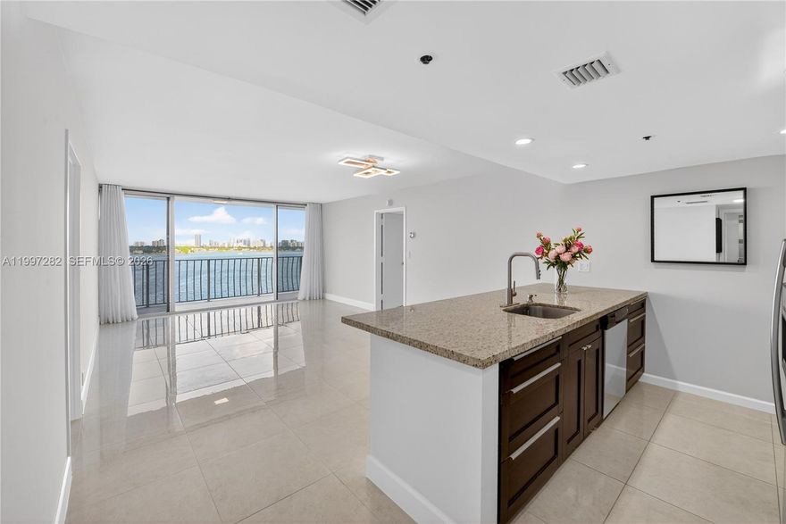 Stunning east-facing waterfront residence in Grandview Palace’s most desirable line, with wide bay views over Normandy Island and a full-width balcony that instantly sets the tone. This well-maintained 2-bedroom, 2-bath split-plan unit offers a bright, open feel, updated finishes, and effortless flow throughout. A washer and dryer are located inside the unit, and every room opens to the balcony, with access from both bedrooms and the living room, creating a seamless indoor-outdoor experience. Set within a full-service building featuring 24-hour security, marina access, pool, fitness amenities, plus shops and restaurants on the ground level, this unit also comes with two parking spaces, which is rare in the area. Waterfront living, convenience, and value come together beautifully here.