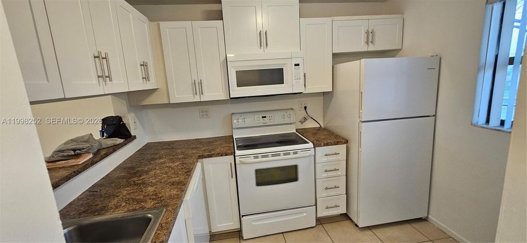 Photo of 3396 Foxcroft Rd #310, Miramar, FL 33025 (MLS # A11998252)
