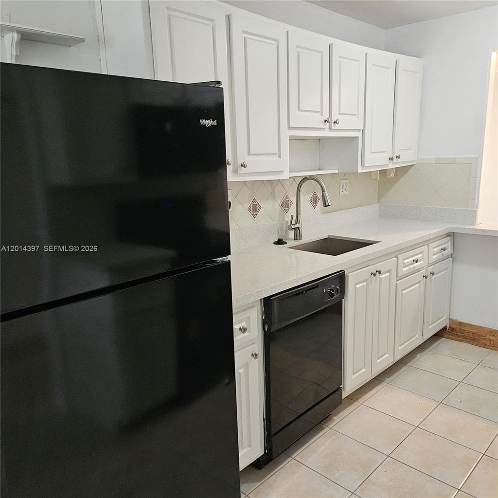 Photo of 3070 NW 48th Ter #104, Lauderdale Lakes, FL 33313 (MLS # A12014397)