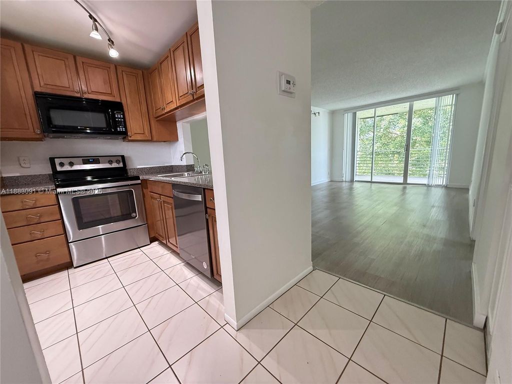 Photo of 9235 Lagoon Pl #408, Davie, FL 33324 (MLS # A11883091)