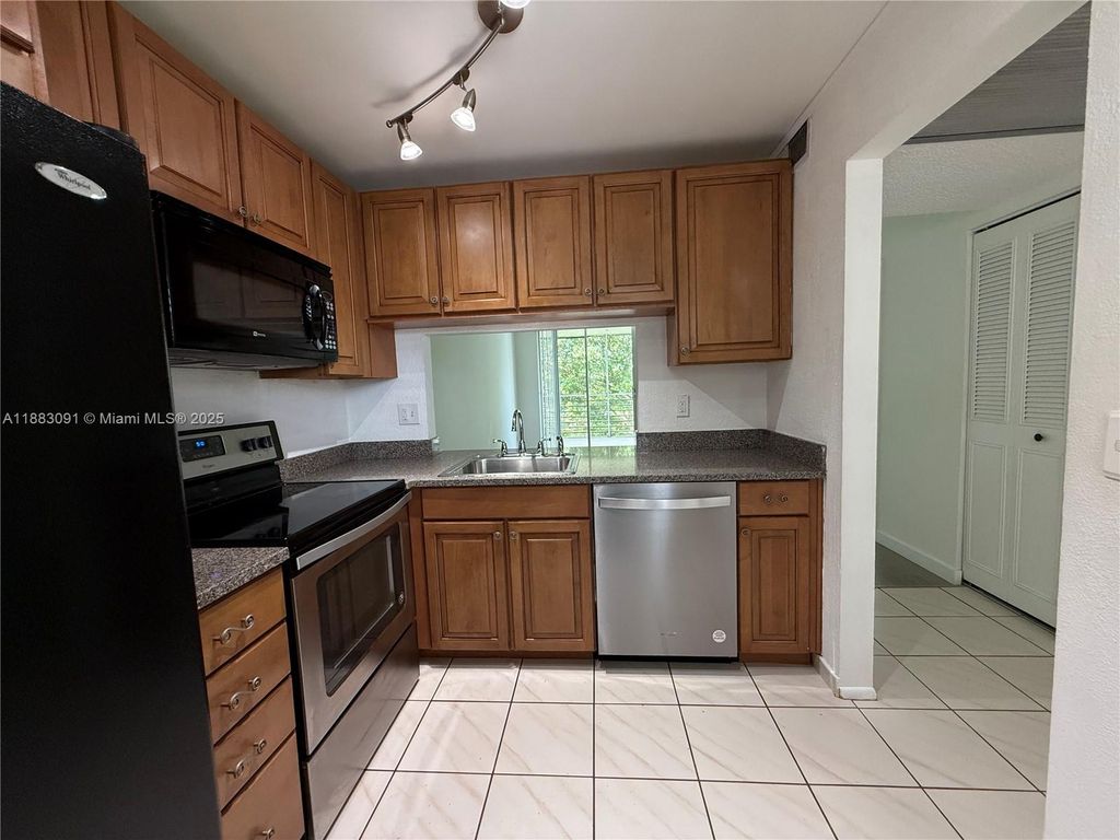 Photo of 9235 Lagoon Pl #408, Davie, FL 33324 (MLS # A11883091)