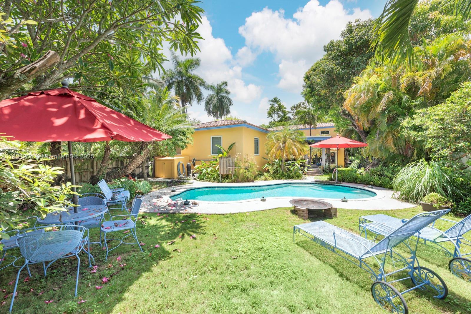 Charming Biscayne Park Oasis with Artisan Craftsmanship and Lush Outdoor Living. In the heart of Biscayne Park, this 3-bedroom, 2-bathroom home blends warmth, smart design, and craftsmanship. Though 1,500 SF, the efficient layout lives large and includes plumbing for a third bath. Features include impact windows and a custom kitchen with solid wood cabinets, slate countertops, and high-end finishes—crafted by the owner, a master carpenter. French doors lead to a covered porch and private backyard with pool, lush landscaping, and outdoor shower. A detached two-story, air-conditioned workshop with garage doors and loft is ideal for creatives. Tools negotiable. Perfect for entertaining, relaxing, or working from home—this rare lifestyle property sits in one of Miami’s walkable neighborhoods.