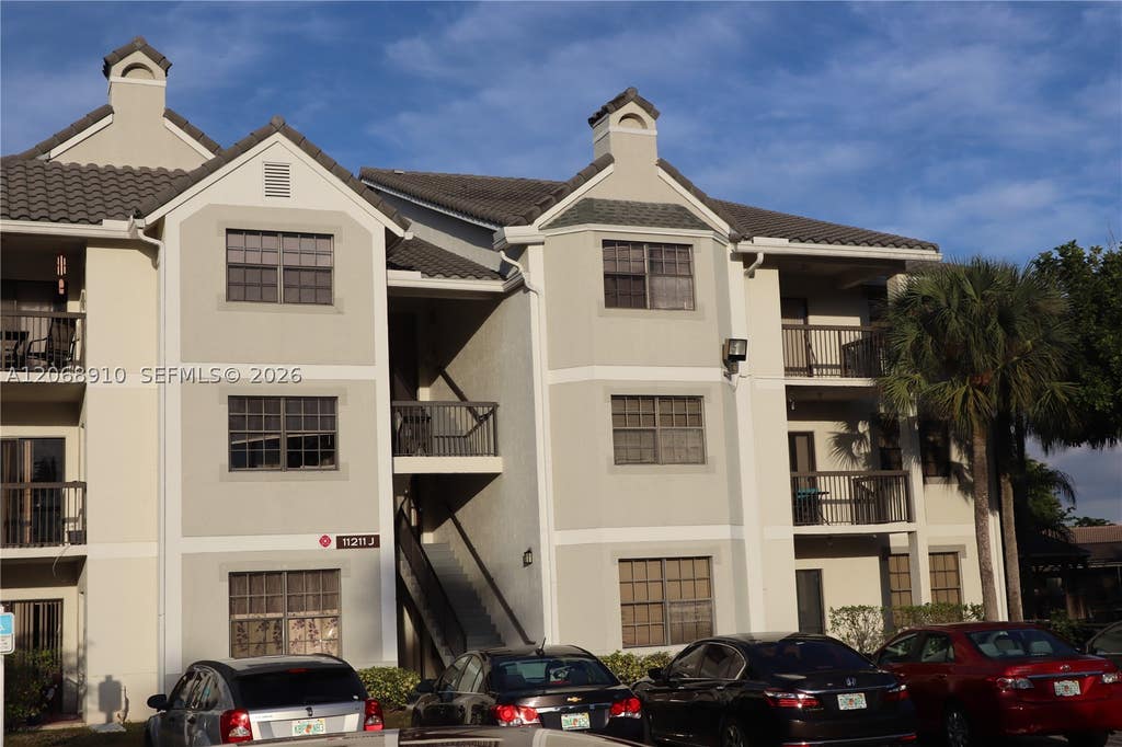 Photo of 11225 W Atlantic Blvd #203, Coral Springs, FL 33071 (MLS # A12068910)