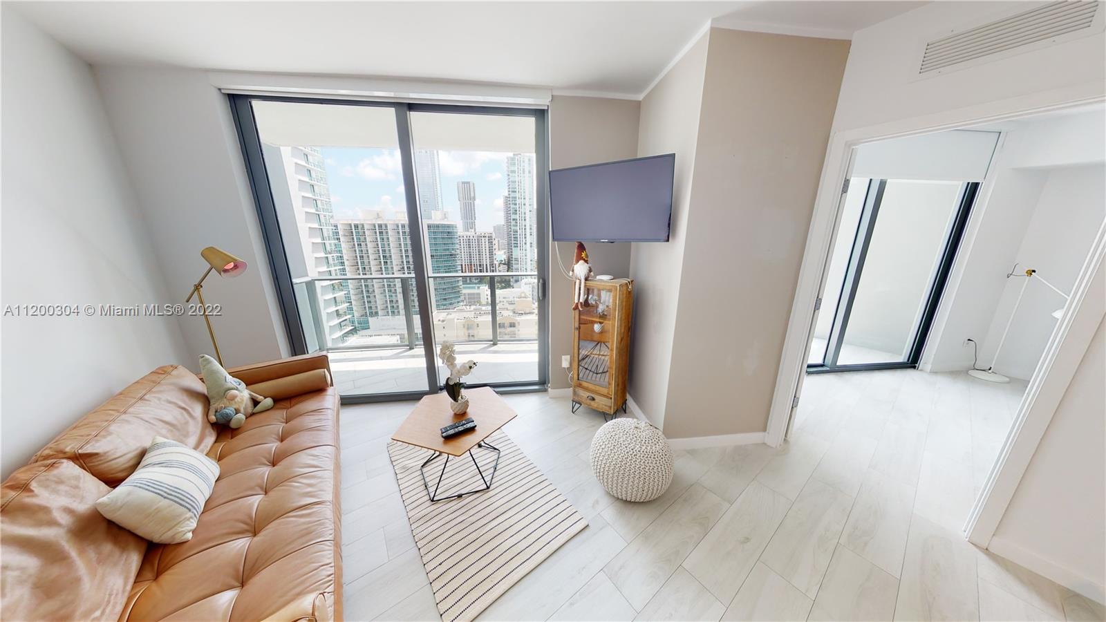 Be the FIRST to live in this unit (COMES FURNISHED). It's has never been lived in full time. This modern One-bedroom apartment is located in the most trending neighborhood in Miami! Edgewater is just minutes away from Design District one of the most luxurious shopping and lifestyle destinations.This unit has a 1 bedroom + DEN and 1.5 bathroom. Unit featuring BOSCH appliances, washer/dryer inside, AUTOMATIC BLINDS, BUILT IN CLOSETS, UPGRADED FLOORS. Condo has incredible designer finishes by Karim Rashid including. Many amenities: tennis court, pool, BBQ grills, lounge beds, spa, sauna, treatment rooms, fitness center, movie room, billiards, kids room, club room and STUNNING 46th floor pool deck! Unit (AS IS W/ ALL WEST ELM FURNITURE )can be rented as many as 12 TIMES PER YEAR|EASY TO SHOW|