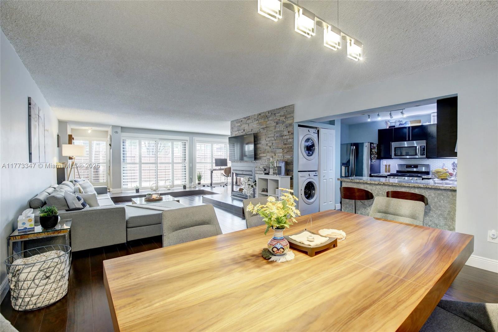 Stunning completely remodeled townhome in Snapper Village! Picturesque floor to ceiling windows let in tons of natural light to the main living space, which features an open concept with dining/living and chefs kitchen with granite countertops and stainless steel appliances. Oversized primary suite with direct access to the private backyard, dream walk-in closet, and huge spa-like primary bathroom with double sinks and an oversized steam shower! This townhome is originally a 3 bedroom, but the third bedroom has been opened and is used as a modern open air office space that can easily be converted back with an in-suite bathroom. HOA fees cover exterior maintenance and insurance, reserves, cable, internet, and water. HOA has oversized pool and party area, and 24 hour guard entry.