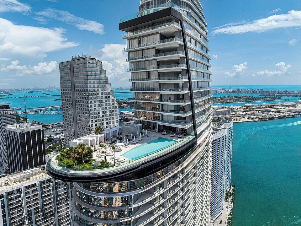 Experience elevated luxury in this 3-bedroom, 3.5-bath residence at Aston Martin Residences, Miami’s most iconic waterfront tower.
Perched on the 47th floor, enjoy panoramic views of Biscayne Bay through floor-to-ceiling glass walls.
Featuring an open-concept layout, Italian cabinetry, Gaggenau appliances, and a private terrace.
Includes 2 garage spaces, exclusive amenities, and legendary Aston Martin design in every detail.