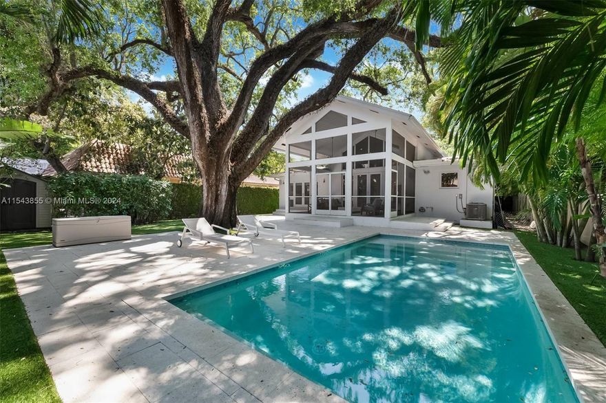 Discover your urban retreat nestled beneath the shade of Coconut Grove's historic oak trees. Escape to tranquility daily in this beautifully rebuilt home, boasting a sunlit living room with skylights and a flexible floor plan. The open kitchen flows seamlessly to the family room under a towering tongue and groove vaulted ceiling, extending to a screened sunroom/patio overlooking the lush backyard. Perfect for entertaining, this home underwent a complete renovation by architect Suzanne Martinson, further enhanced by adding a bedroom, bathroom and new swimming pool. Modern features include impact windows and doors, a gas cooktop, a new tankless water heater and an AC system. Immerse yourself in this serene oasis with easy access to top-rated schools and Coconut Grove's vibrant lifestyle.