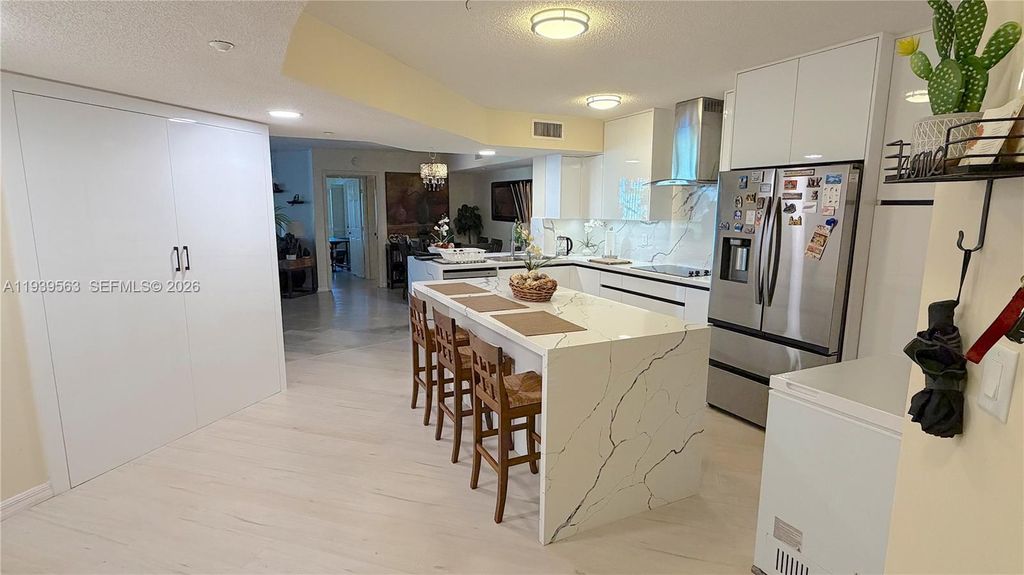 Photo of 9539 Weldon Cir #F207, Tamarac, FL 33321 (MLS # A11939563)