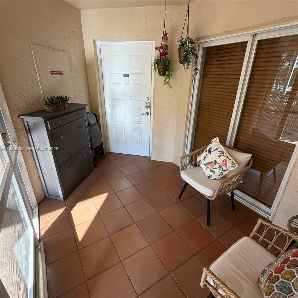 Photo of 9539 Weldon Cir #F207, Tamarac, FL 33321 (MLS # A11939563)