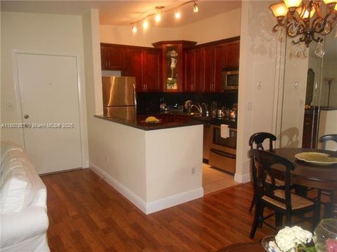 Photo of 7707 Ashmont Cir #214, Tamarac, FL 33321 (MLS # A11807857)
