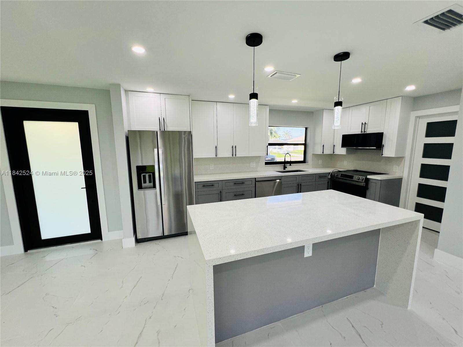 Discover the charm of this beautifully remodeled 3BR, 2BA home in a well-established SE Cape Coral neighborhood. Just minutes from top-rated schools and shopping, this move-in-ready gem features an open layout, modern kitchen with large island, soft-close cabinetry, crown molding, and brandnew high-end appliances. Italian tile flooring runs throughout. Enjoy peace of mind with a new roof, soffits, fascia, impact-resistant windows, doors, and garage door. The oversized, fully fenced lot offers space for a future pool, plus a screened lanai and large patio for outdoor living. All assessments paid. No flood insurance required (Flood Zone X). DPA available with preferred lender. Don’t miss your chance to make this Cape Coral beauty your forever home!