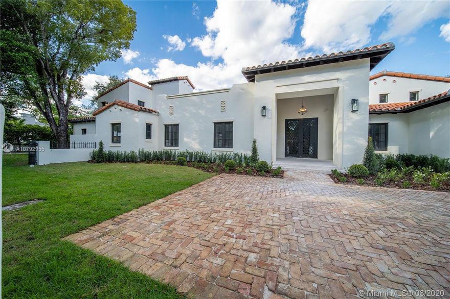Located on an oversized triple corner lot in the prestigious Golden Triangle, this tastefully remodeled Coral Gables estate offers elegant living with Spanish style architecture! The 29,040 sf lot is gated offering privacy; it has picturesque mature oak trees, 30-foot-long heated pool & jacuzzi. Inside, the fully updated home was re-envisioned by architect Ramon Pacheco and the interior design was completed by Errez Design.

This magnificent home has 6 bedrooms, 7 full baths, +2 half baths, staff quarters, a separate 2/2 detached guest house, a 700 bottle walk-in wine cellar, butler’s pantry, outdoor kitchen & 3 car garage. The energy efficient home was brilliantly redone with numerous premium features both inside & out, plus is tech ready.