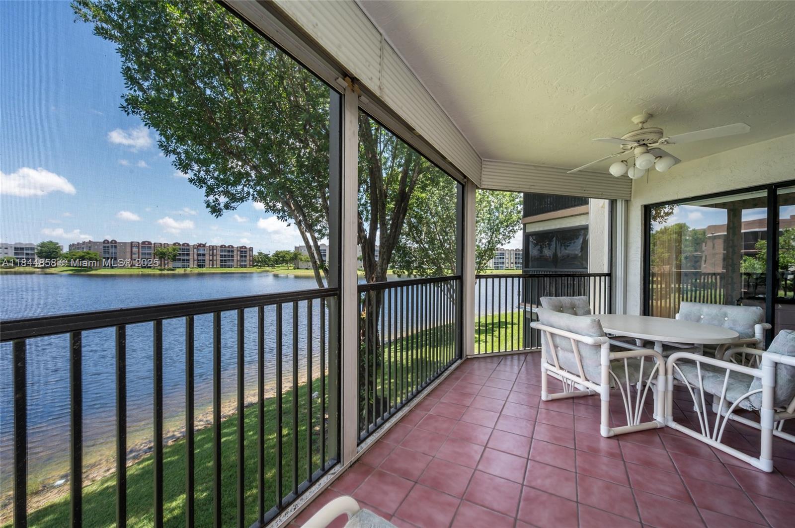 Amazing lake views with resort amenities. Large 2 bedroom, 2 bathroom residence with 1500 interior sq/ft plus a spacious covered balcony. Washer/dryer in the unit and hurricane impact rolling shutters. Gated community featuring a heated community pool (very close to the apartment), tennis courts, basketball court, pickleball, racketball, movie theater, fitness center, library, AND a courtesy bus shuttle. Furniture included / negotiable. Fairways is a 55+ community. Easy to show.