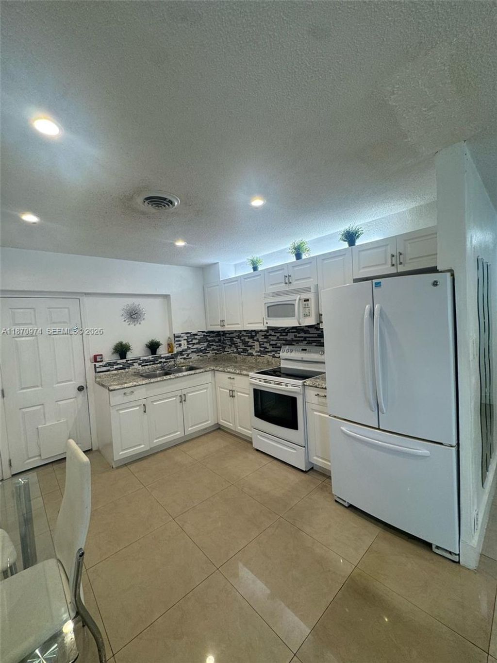 Photo of 4808 NW 27th Ter, Tamarac, FL 33309 (MLS # A11870974)