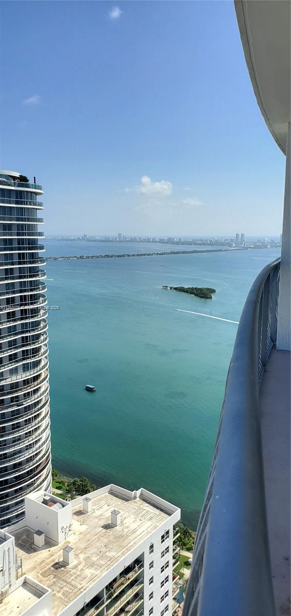 Located on the 54th floor, this spacious 1-bedroom offers sweeping city views and partial views of Biscayne Bay from a stunning wraparound balcony that spans the entire apartment. Recently updated with a brand-new A/C, modern shower system, and new washer & dryer. Features include porcelain flooring, an open layout, and floor-to-ceiling windows. Opera Tower offers resort-style living with a pool, gym, jacuzzi, valet, 24-hour security, convenience store right on the ground floor. It is steps from Margaret Pace Park, dining, cultural hotspots, and minutes away from the airport.