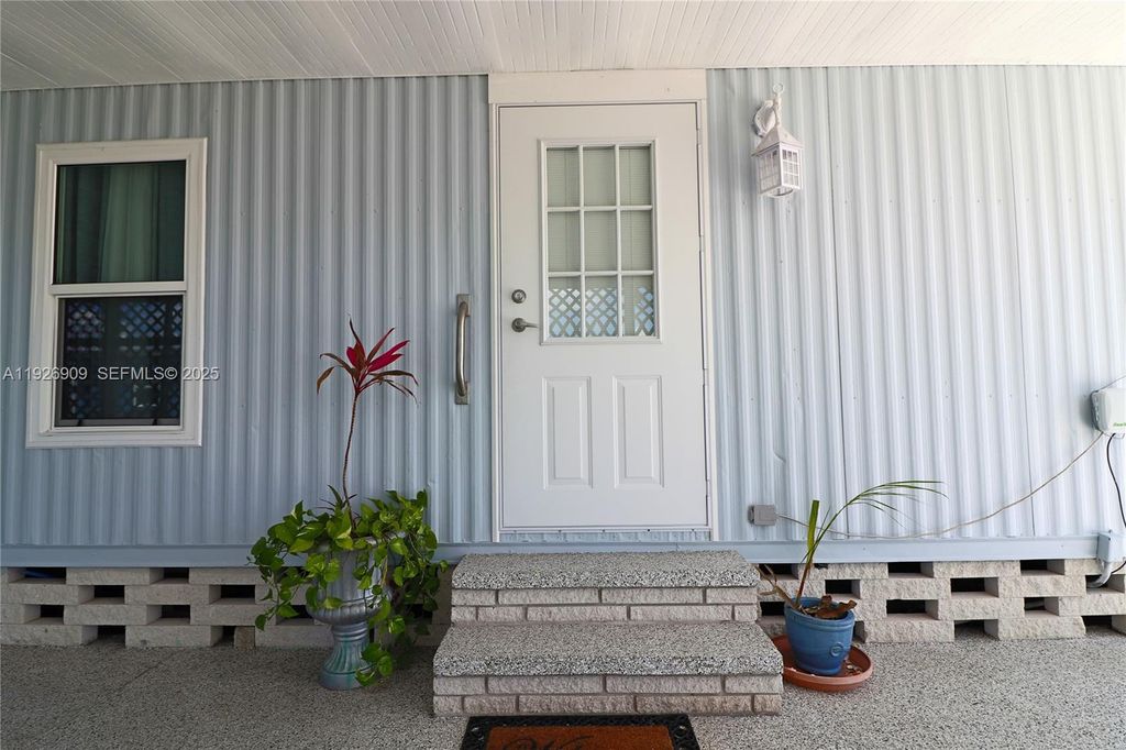 Photo of 221 Grassy Key, Naples, FL 34114 (MLS # A11926909)