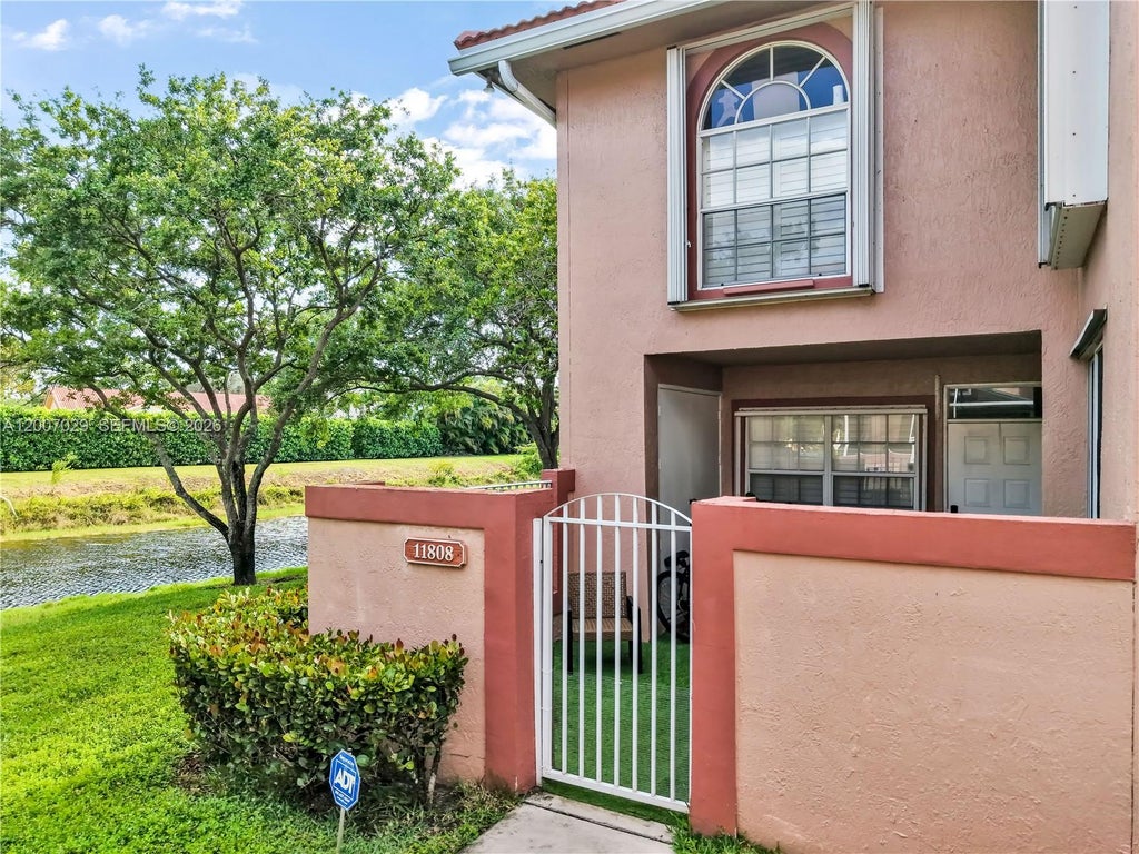 Photo of 11808 Royal Palm Blvd, Coral Springs, FL 33065 (MLS # A12007029)