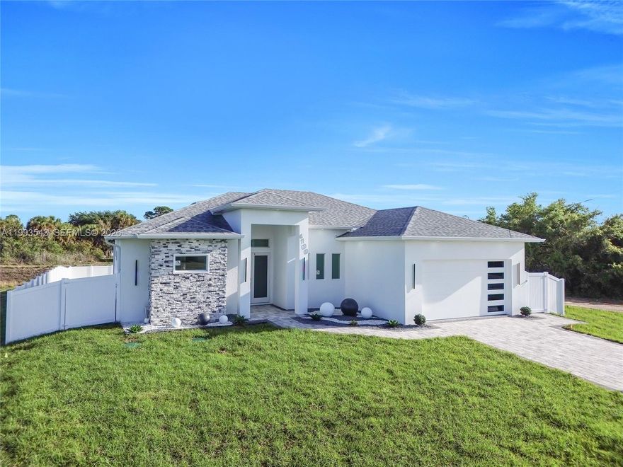 Stunning NEW CONSTRUCTION home featuring a PRIVATE POOL and FULLY FENCED PVC YARD, perfect for relaxing, entertaining, and enjoying the Florida lifestyle. This property offers 3 BEDROOMS + DEN and 2.5 BATHROOMS, designed with MODERN FINISHES and high-quality details throughout. The outdoor space is truly exceptional, including a RESORT-STYLE OUTDOOR SHOWER and a KITCHENETTE AREA, ideal for gatherings and outdoor living. Inside, the home features IMPACT WINDOWS, an OPEN-CONCEPT LAYOUT, and a modern kitchen with CONTEMPORARY CABINETRY and STAINLESS STEEL APPLIANCES. The PRIMARY SUITE serves as a private retreat, featuring a WALK-IN CLOSET and a beautifully designed bathroom with HIGH-END FINISHES. Additional features include a PAVER DRIVEWAY, SPRINKLER SYSTEM, and a LOW-MAINTENANCE MINIMALIST LANDSCAPE DESIGN. This home is designed for comfort, privacy, and enjoying every moment outdoors.