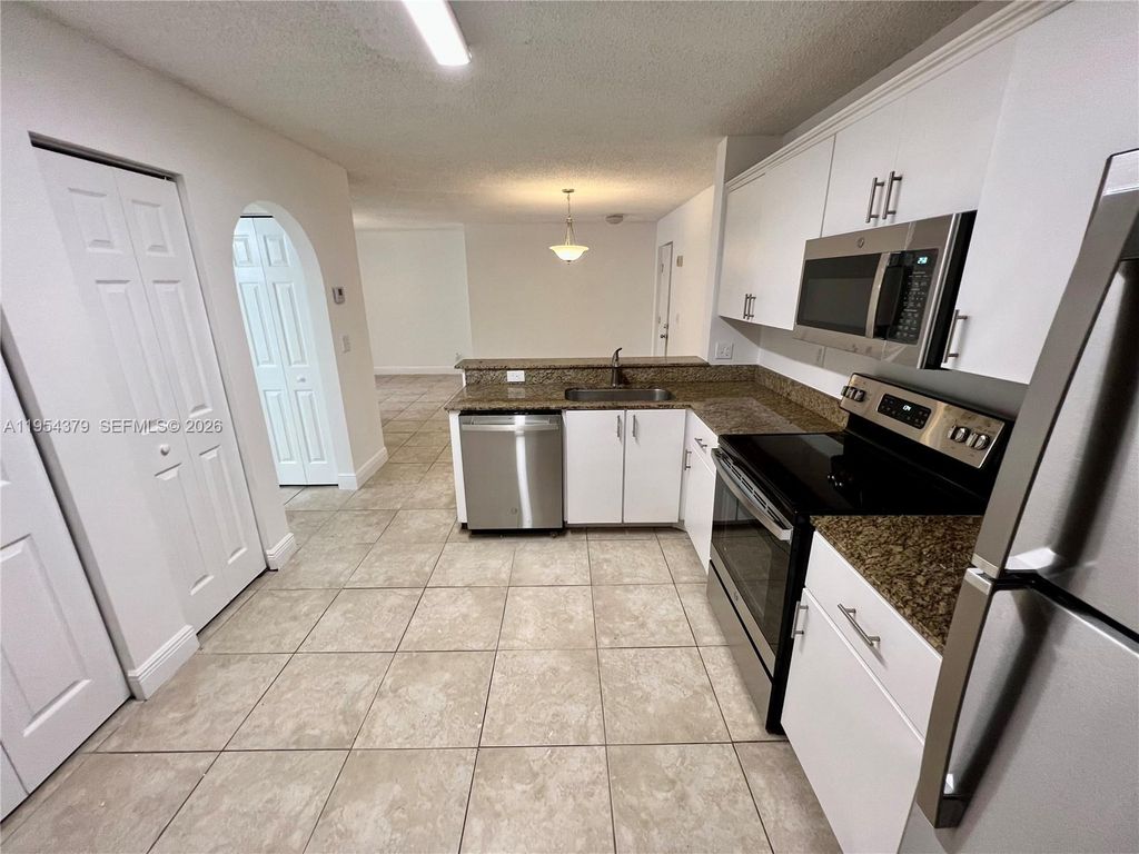 Photo of 10131 W Sunrise Blvd #203, Plantation, FL 33322 (MLS # A11954379)