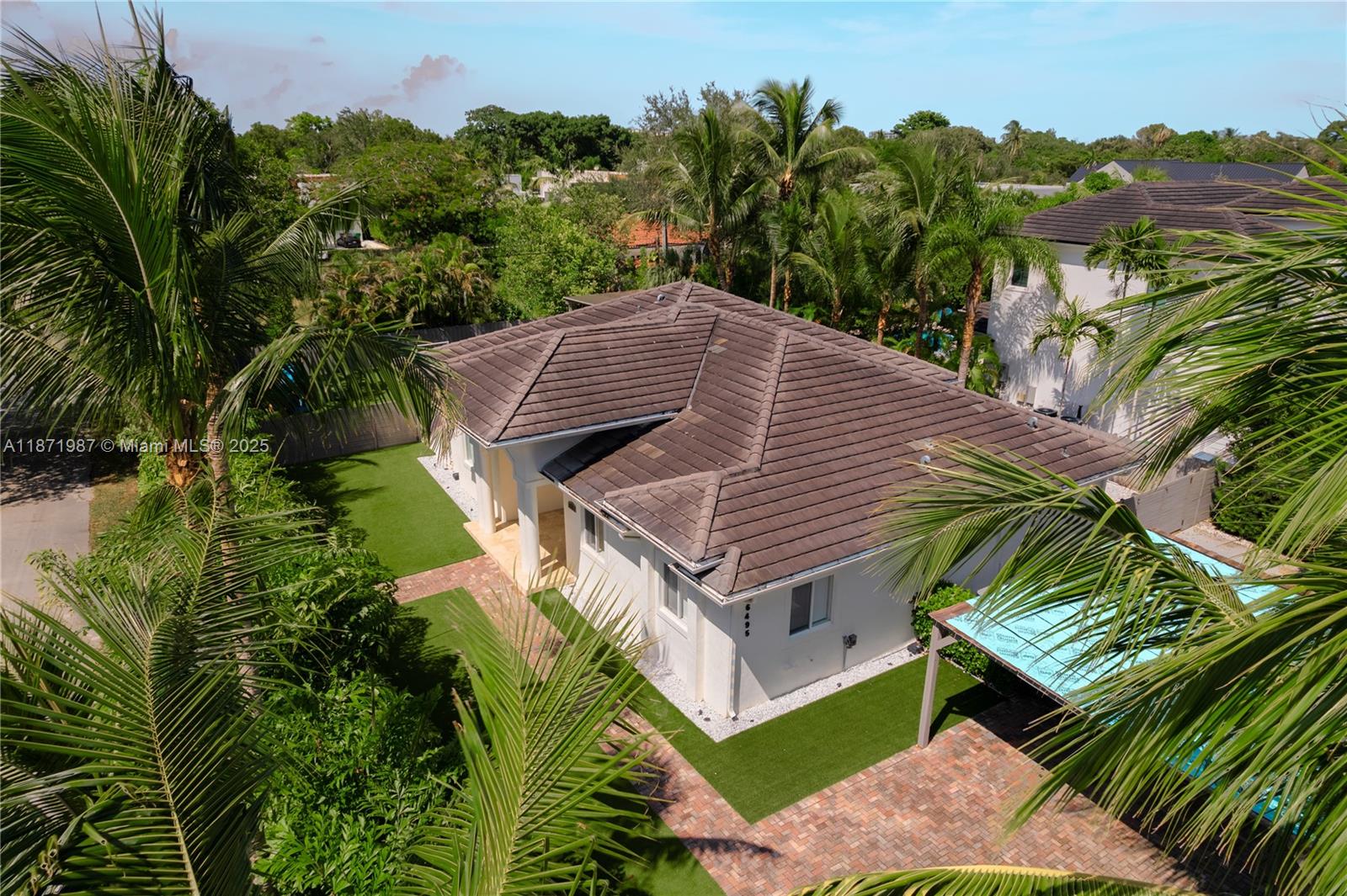Beautiful and move-in ready 5-bedroom, 4-bath home in heart of Pinecrest/South Miami with 3,225 adjusted sq ft on an oversized 11,271 sq ft corner lot. The open layout brings natural light, high ceilings, and a spacious kitchen with center island, ideal for gatherings and everyday living. Updates include remodeled closets, fencing, outdoor lighting, natural gas, roof insulation, security cameras, and a new A/C compressor for peace of mind. Outside, enjoy a re-plastered saltwater pool with new tile and heater, artificial turf with playground, lush landscaping, and a shaded pergola—perfect for entertaining or relaxing. Minutes from Dante Fascell Park, top schools, Trader Joe’s, Dadeland, and Miami’s best dining and shopping, this turnkey home offers comfort, convenience, and prime location.