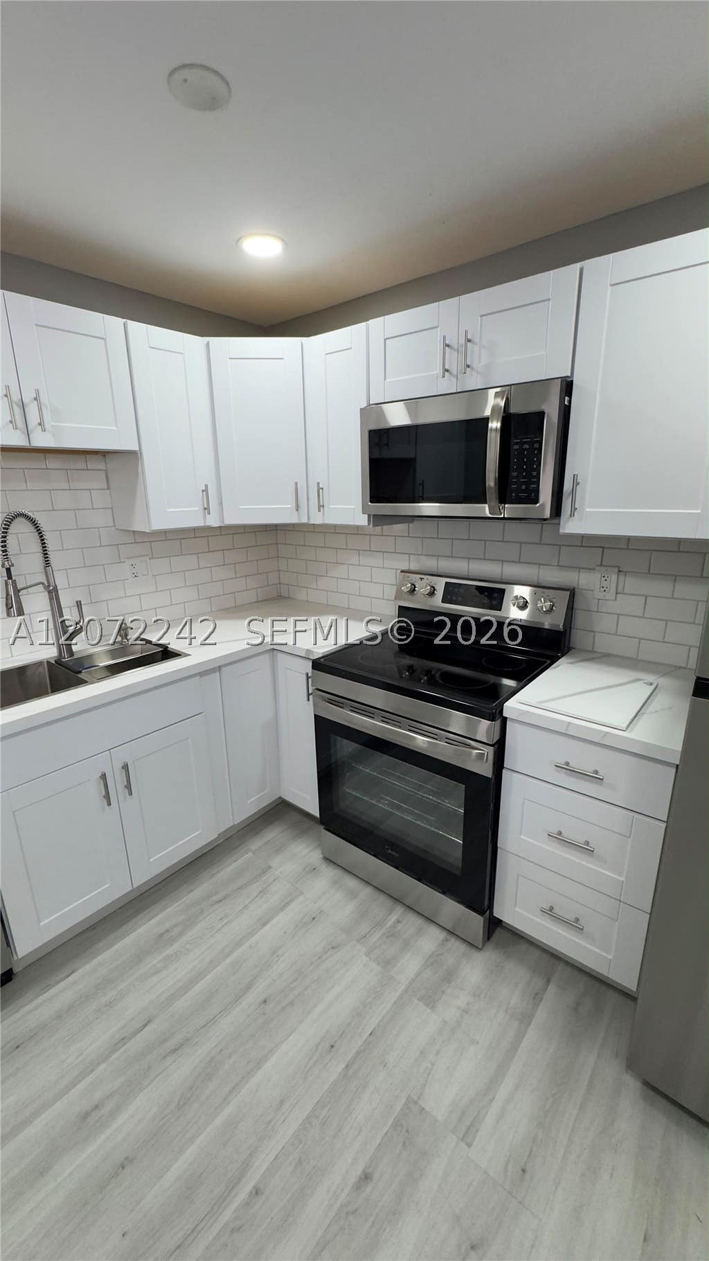 Photo of 1280 NW 43rd Ave #303, Lauderhill, FL 33313 (MLS # A12072242)